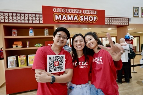 Volunteering with teammates at an OCBC community event