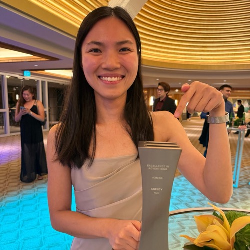 Holding the Excellence in Advertising trophy at the Marketing Excellence Awards